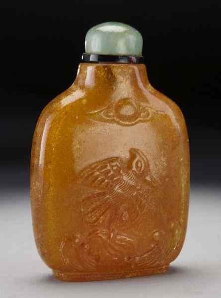 Appraisal: Chinese Qing caved amber snuff bottle depictingdeer birds and plum