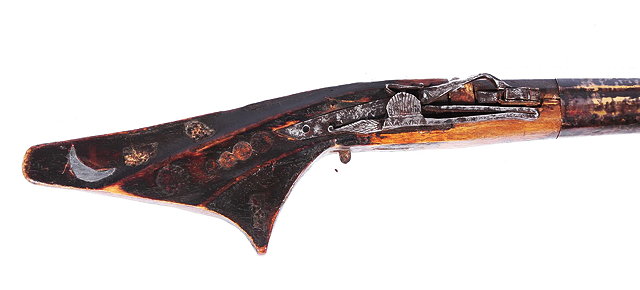 Appraisal: AN EASTERN WOOD AND METAL LONG GUN with engraved steel