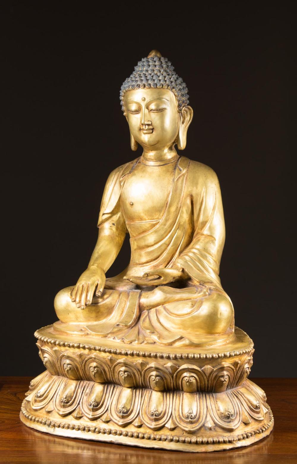 Appraisal: CHINESE GILT BRONZE BUDDHA SCULPTURE depicting a seated Buddha with