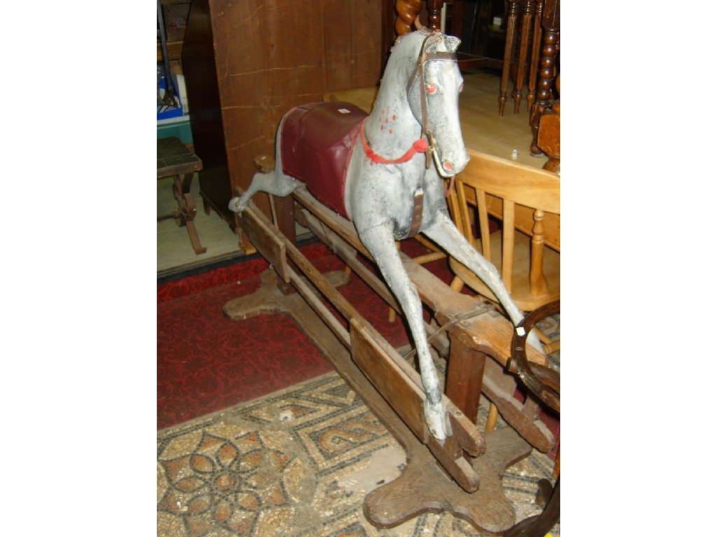 Appraisal: A Victorian rocking horse with painted finish raised on a