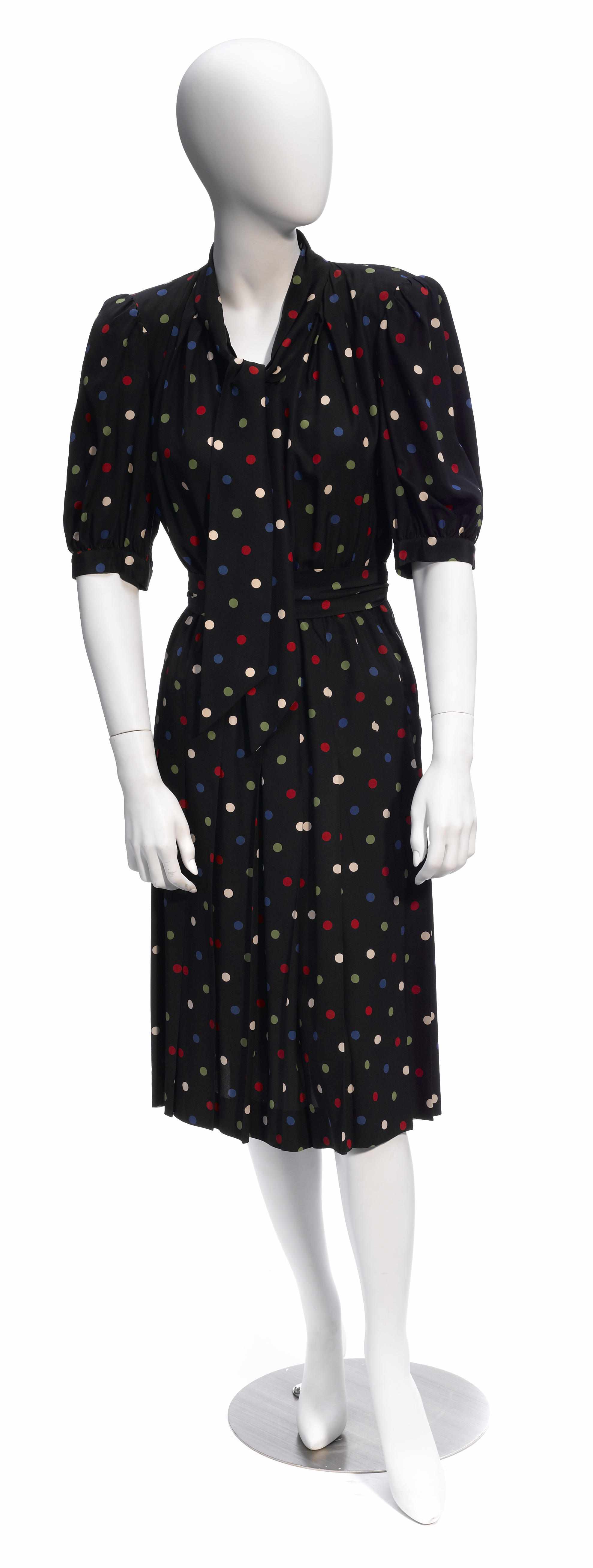 Appraisal: An Yves St Laurent black multicolored polka dot short sleeve