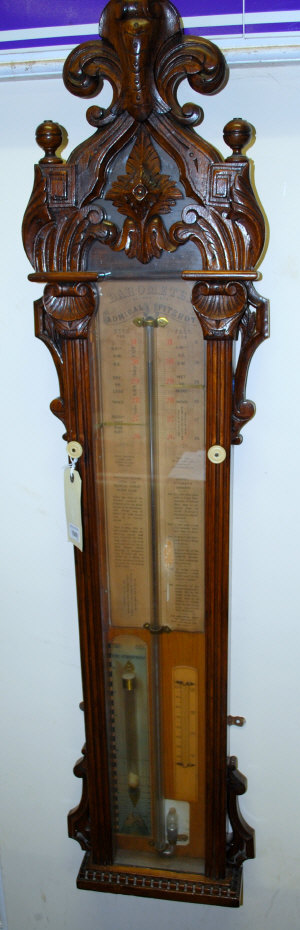 Appraisal: A late Admiral Fitzroy oak cased barometer with printed register