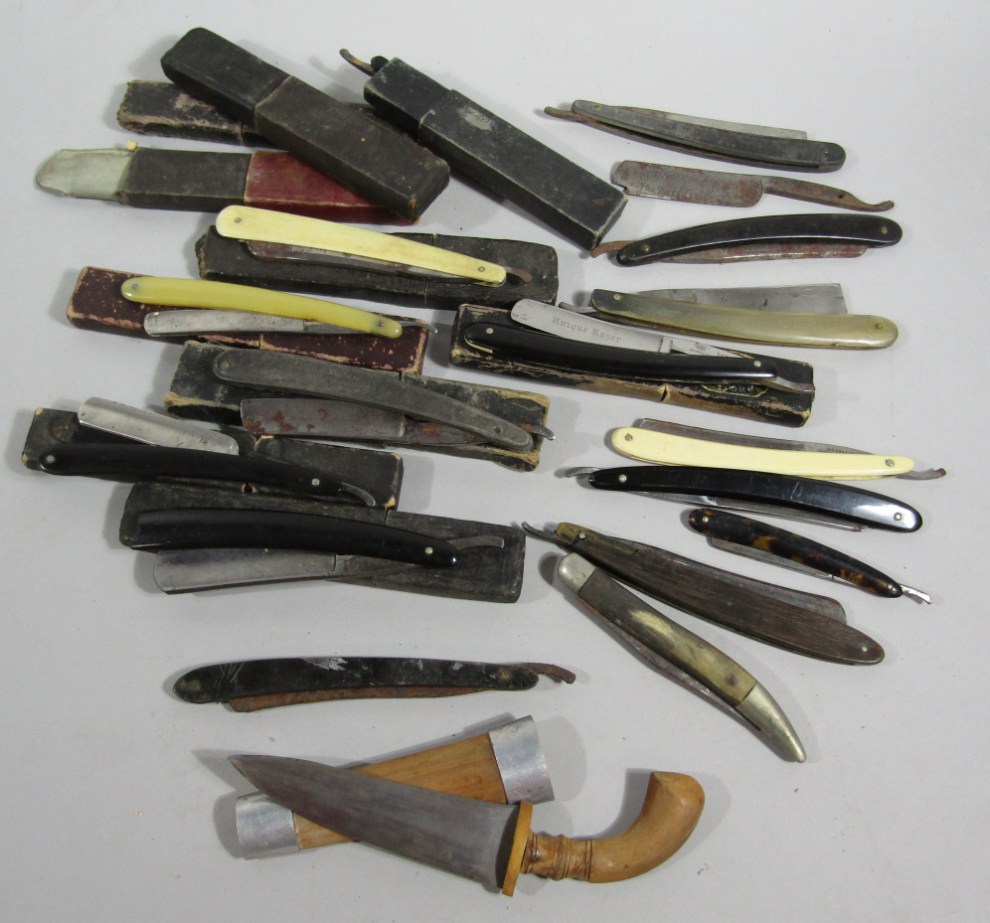 Appraisal: A small collection of antique cut throat razors and a