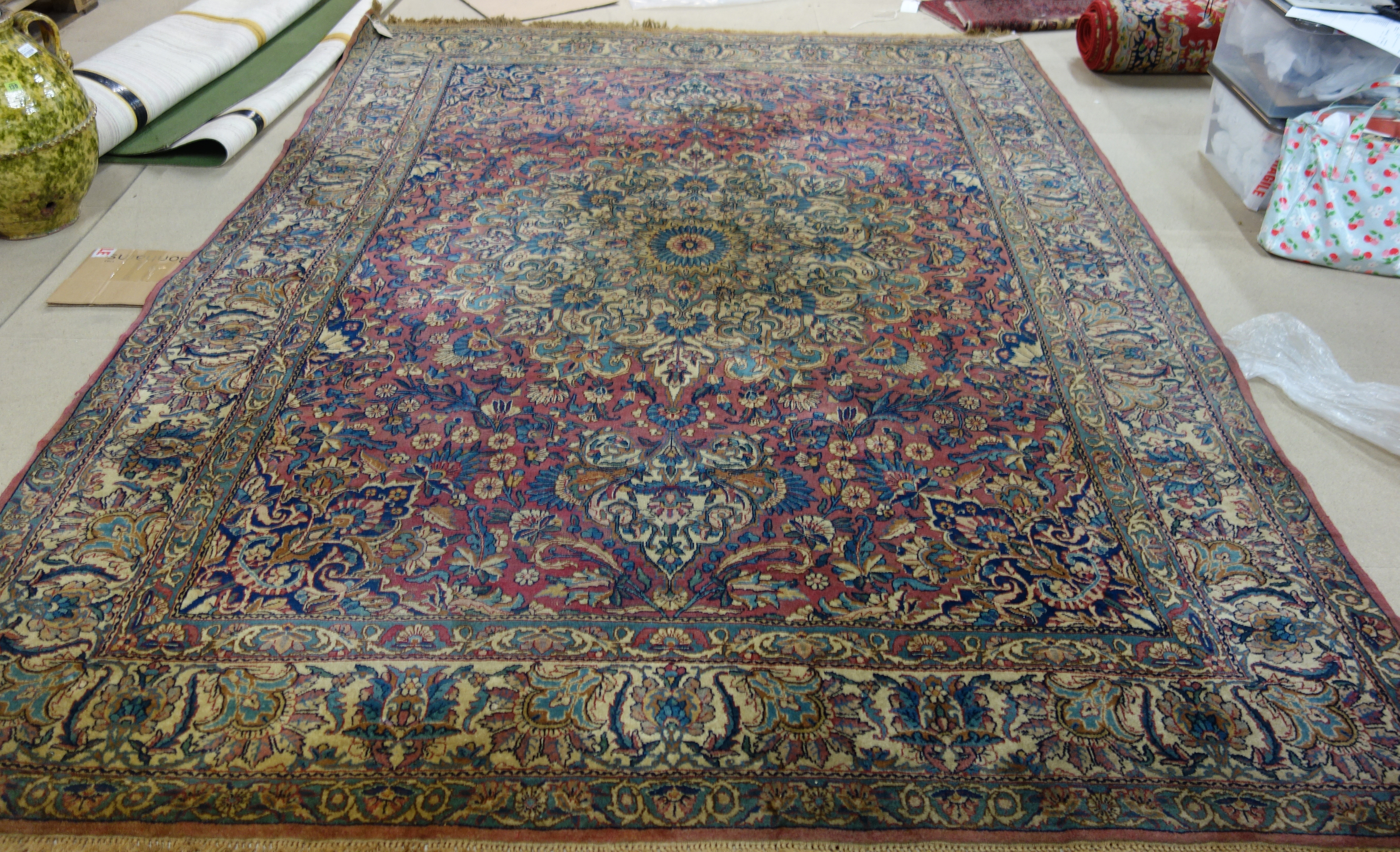 Appraisal: A Kerman carpet Persian the pink field with a bold