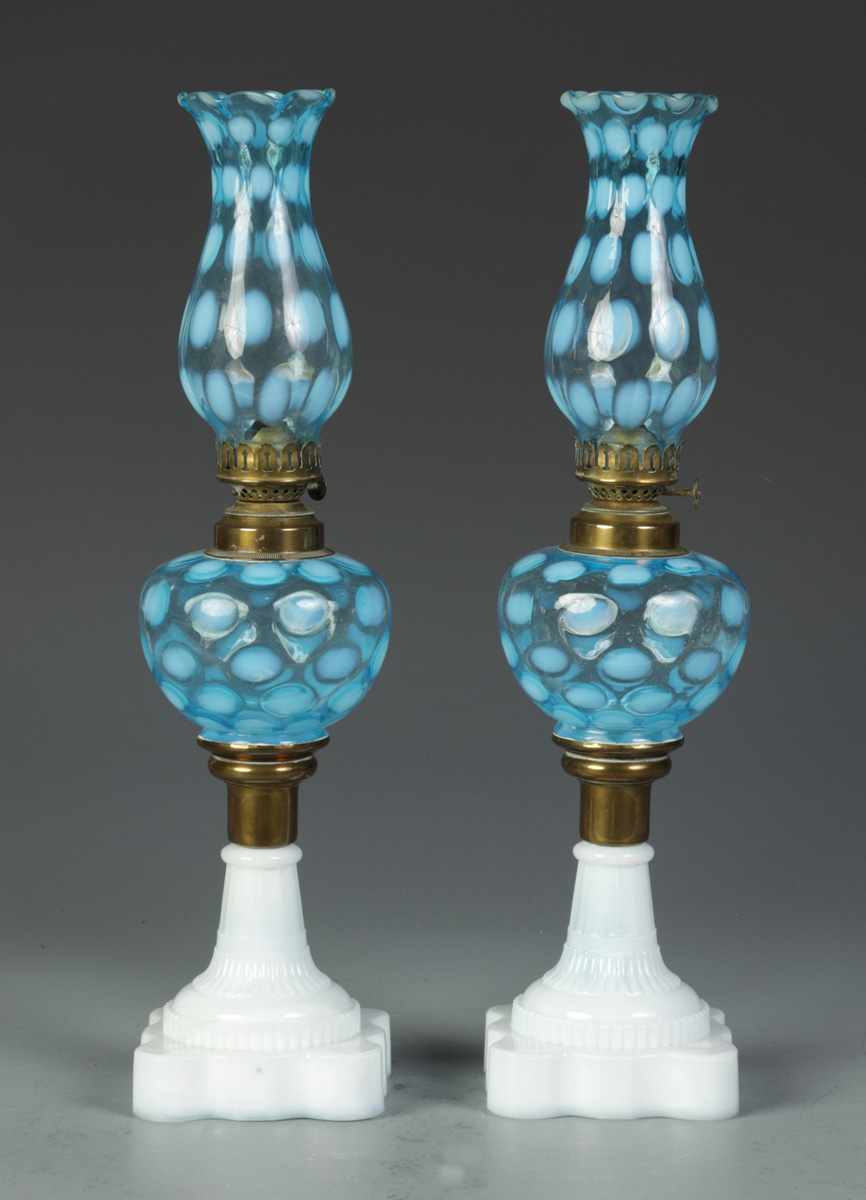 Appraisal: Pair of Blue Coin Spot Oil Lamps Small chip to