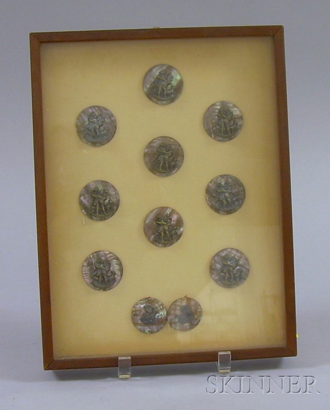 Appraisal: Framed Group of Eleven Bronze Figural-mounted Abalone Shell Buttons nine