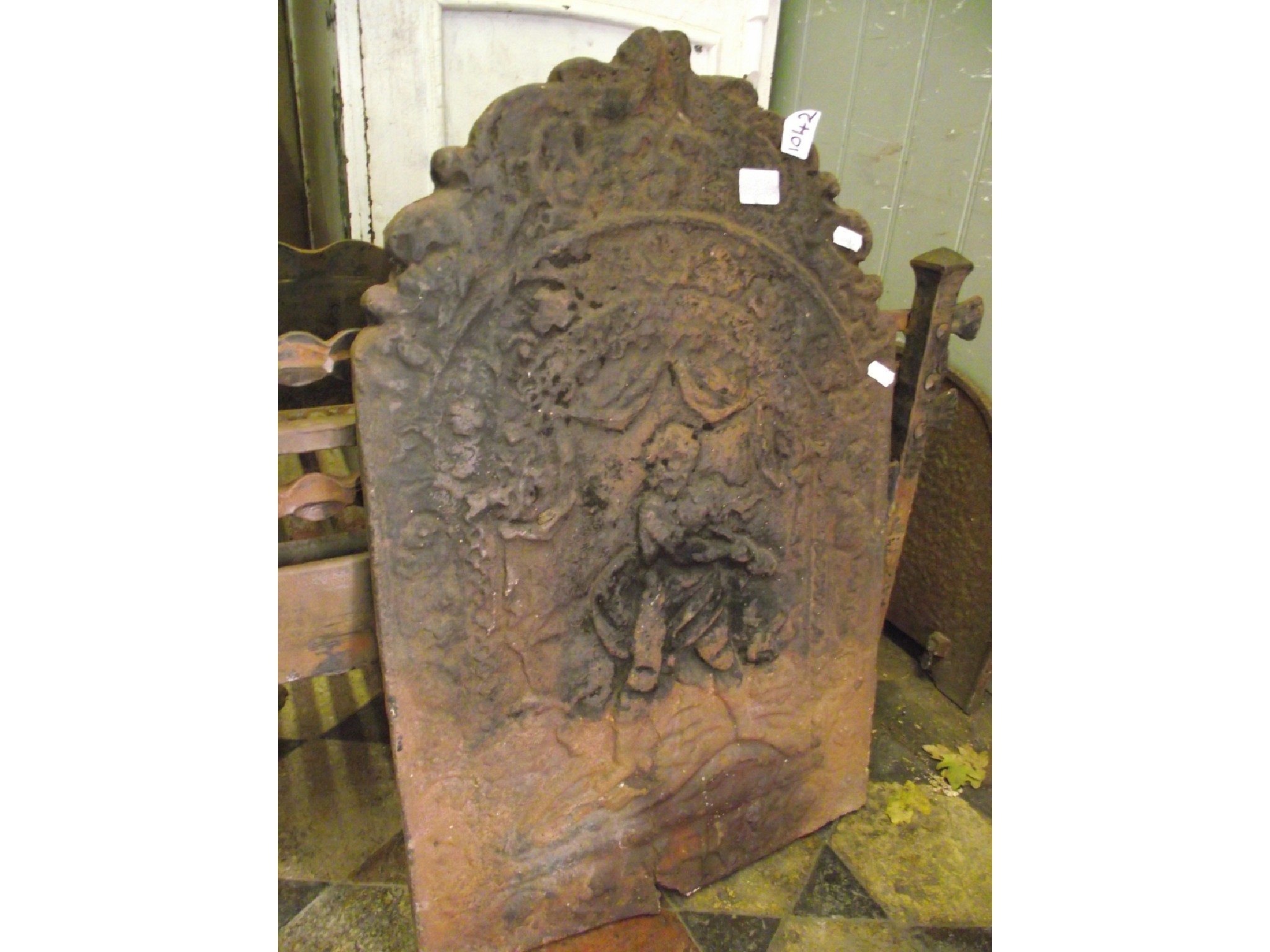 Appraisal: A th century cast iron fire back of arched form