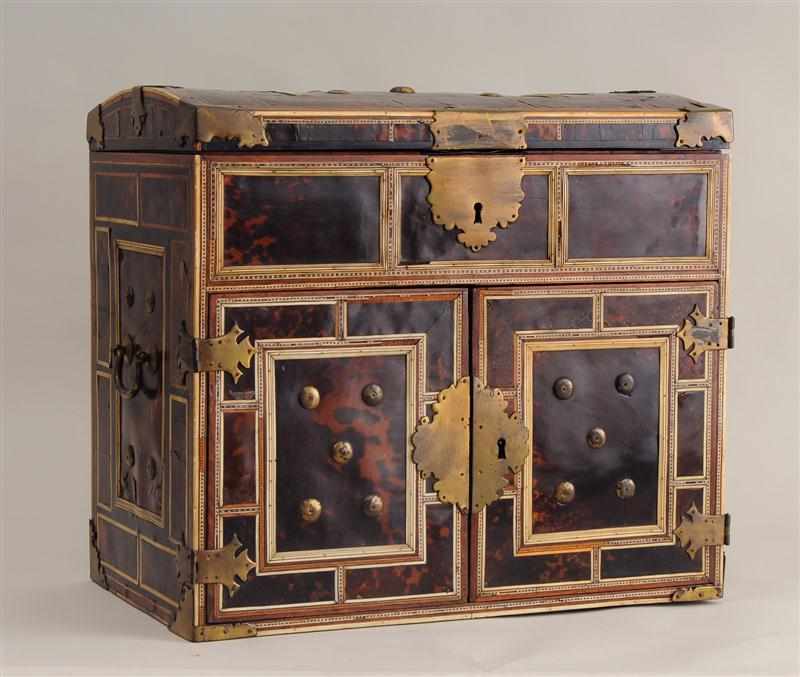 Appraisal: CONTINENTAL BAROQUE BRASS-MOUNTED IVORY-INLAID TORTOISESHELL COFFRET The domed hinged lid