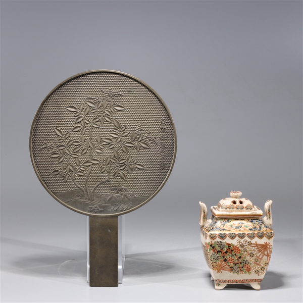 Appraisal: Japanese bronze mirror with molded leaf designs together with Satsuma