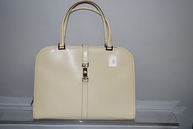 Appraisal: Gucci bone leather handbag with zip top large Good condition