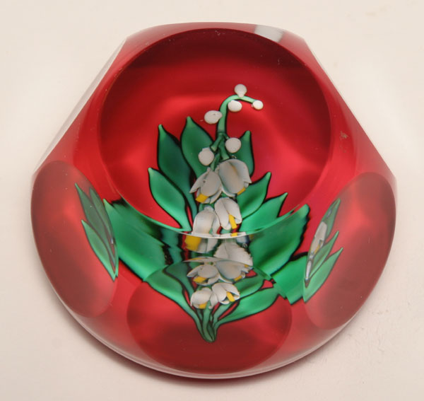 Appraisal: Saint Louis French faceted glass paperweight internally decorated with lily