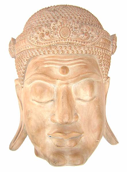 Appraisal: An Indonesian carved wood buddha mask height in