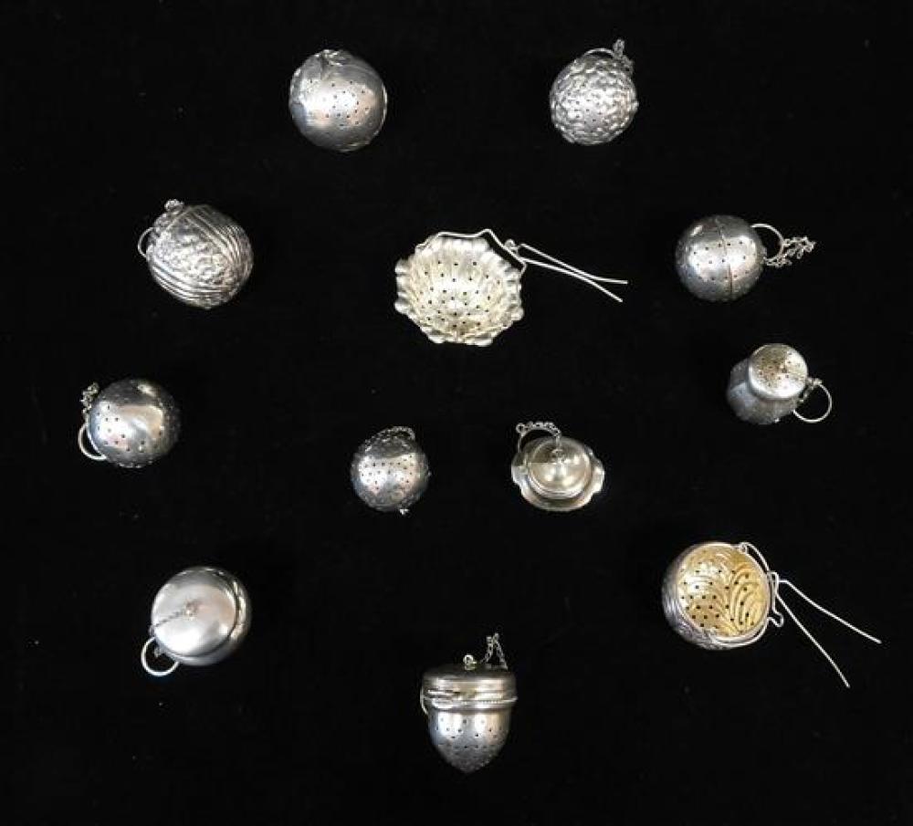 Appraisal: SILVER Twelve sterling tea infusers and strainers all marked includes