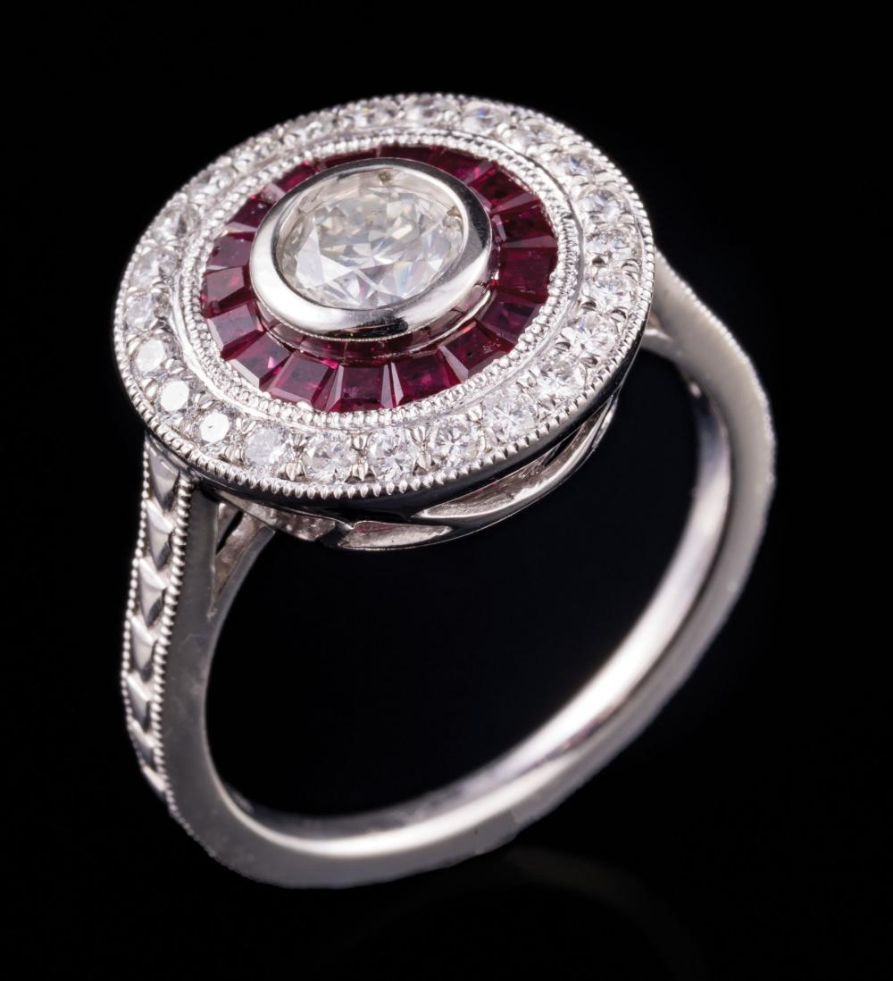 Appraisal: Platinum Diamond and Ruby Ring center bezel set round brilliant