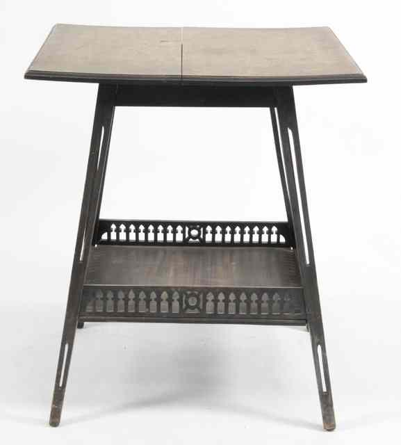 Appraisal: A two-tier table the square top on pierced legs united