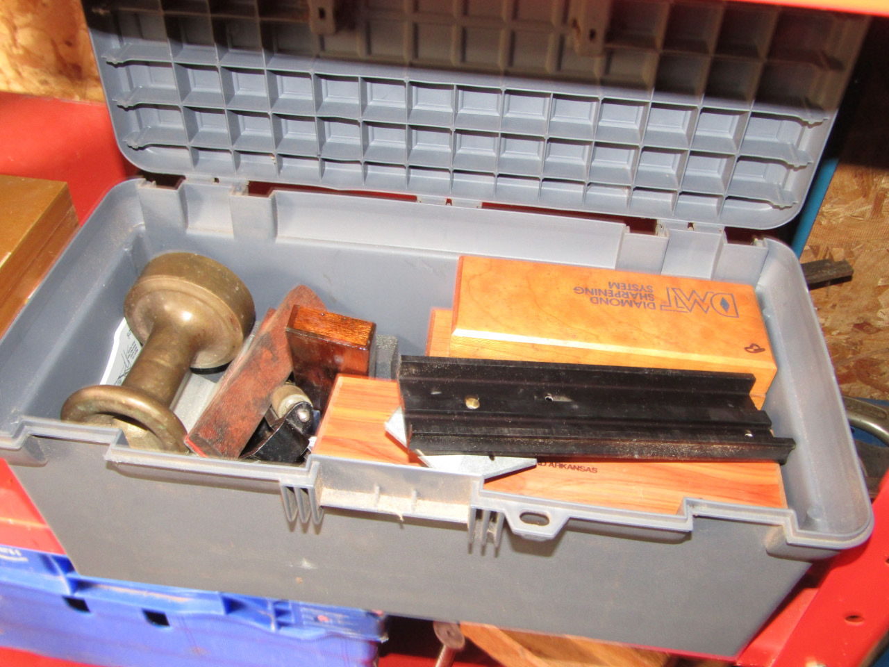 Appraisal: A small tool box containing various cased sharpening stones