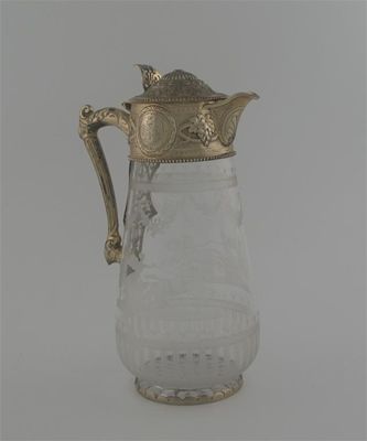 Appraisal: A Victorian silver gilt mounted cut glass claret jug etched