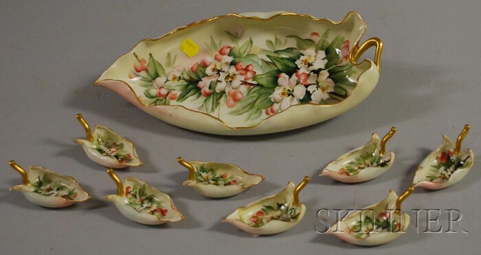 Appraisal: Nine-piece Gilt and Hand-painted Limoges Porcelain Leaf-form Nut Set a