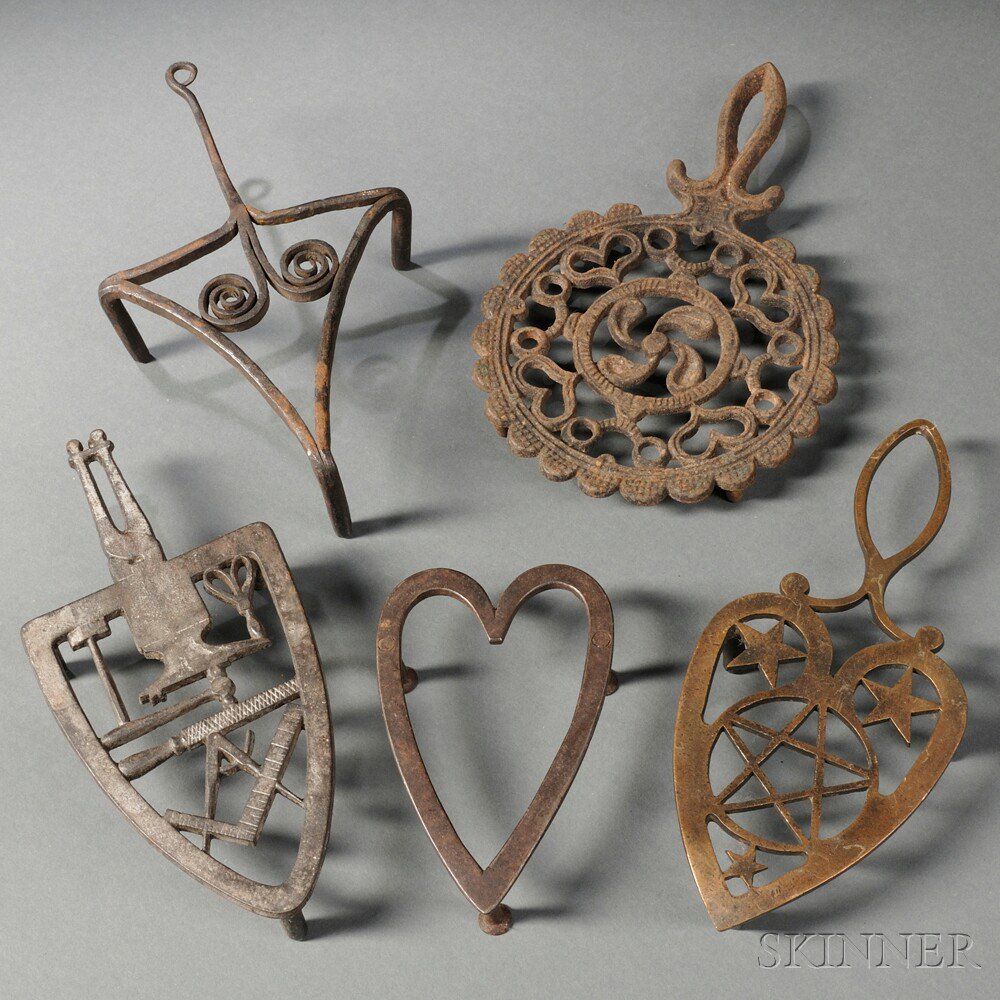 Appraisal: Five Wrought and Cast Metal Trivets th to th century