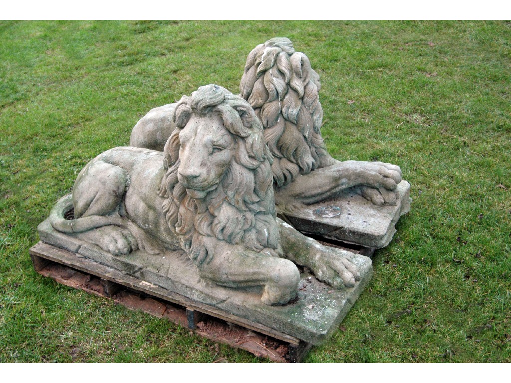 Appraisal: A large pair of Garden Figures of recumbant Lions on