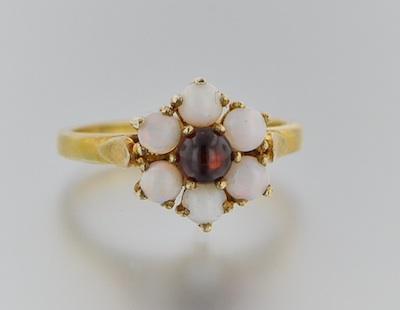 Appraisal: A Ladies' Vermeil Opal and Garnet Ring Vermeil ring set