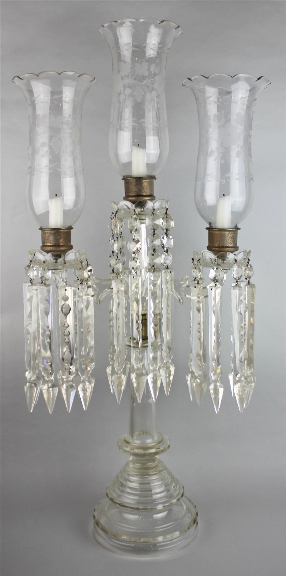 Appraisal: AMERICAN CUT AND MOLDED GLASS CANDELABRUM with faceted scroll arms