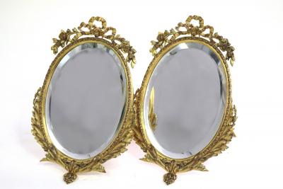 Appraisal: A pair of gilt metal framed oval mirrors with easel