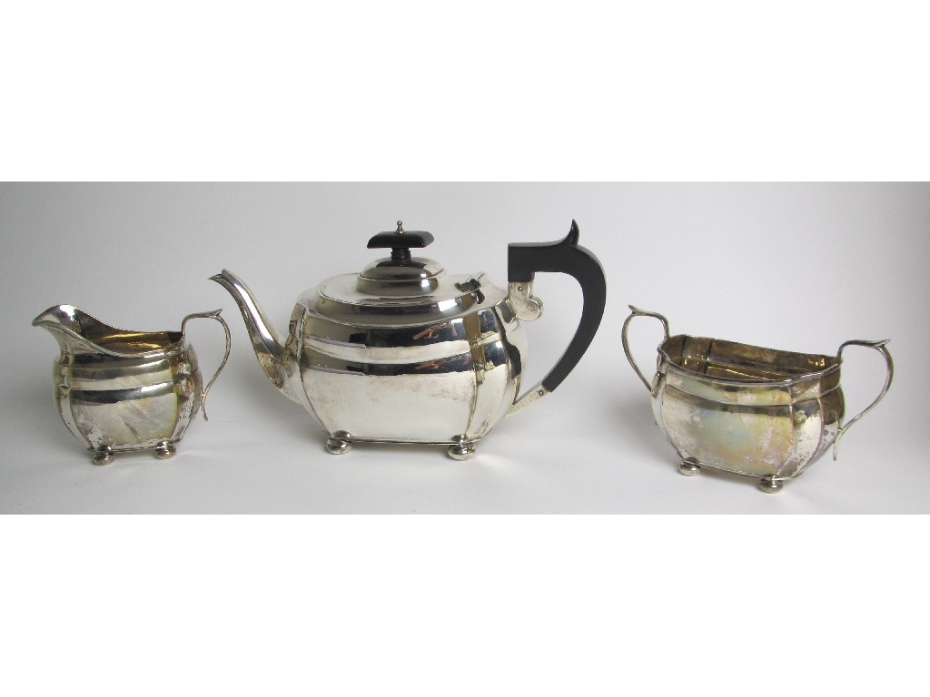 Appraisal: A three piece silver tea service of rounded rectangular form