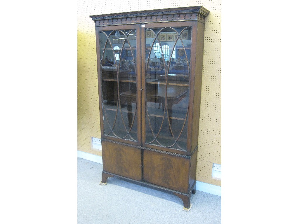 Appraisal: Mahogany two door bookcase on cabinet