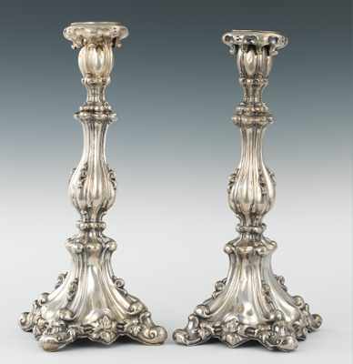 Appraisal: A Pair of Silver Candlesticks Elaborately fashioned with organic and