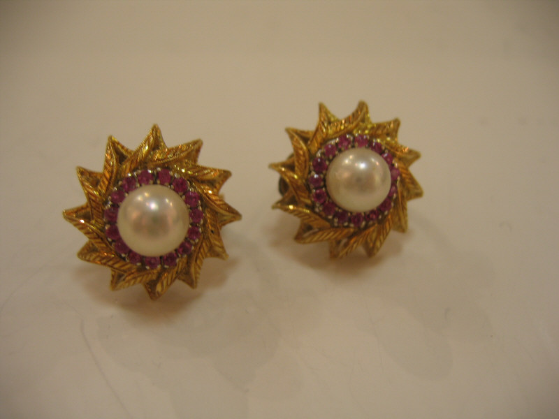 Appraisal: PEARL AND RUBY EARRINGS Yellow gold starburst earrings set with