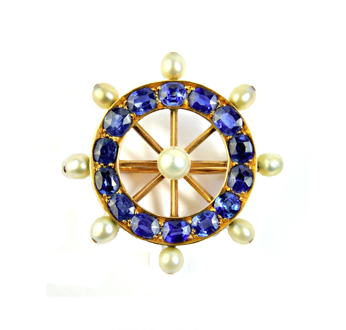 Appraisal: A gold sapphire and cultured pearl brooch designed as a