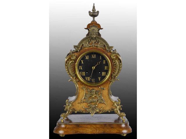 Appraisal: Brass and Wood French Clock Description Time and strike Works