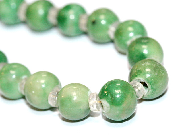 Appraisal: A CHINESE JADE BEAD NECKLACE with rock crystal spacers long