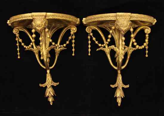 Appraisal: A pair of George III style giltwood wall brackets ft