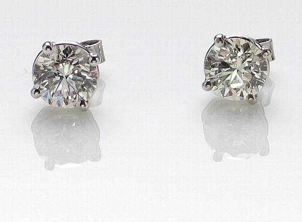 Appraisal: A pair of diamond ear studs estimated total diamond weight