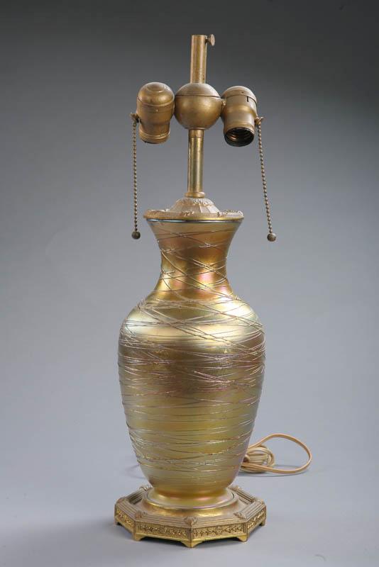 Appraisal: ART GLASS TABLE LAMP Attributed to Durand Iridescent gold vase-form