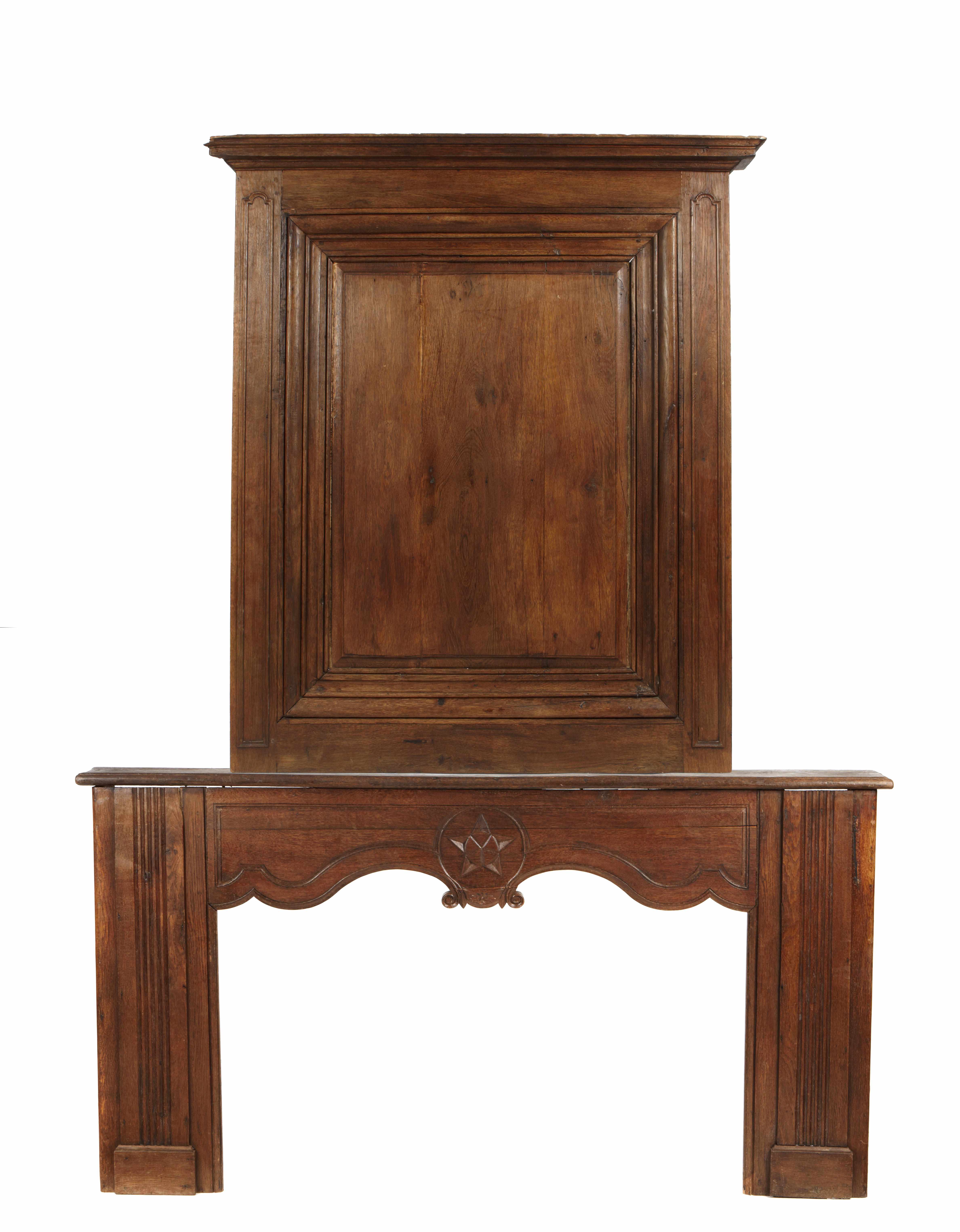 Appraisal: A Louis XIV style oak fire surround with paneled superstructure