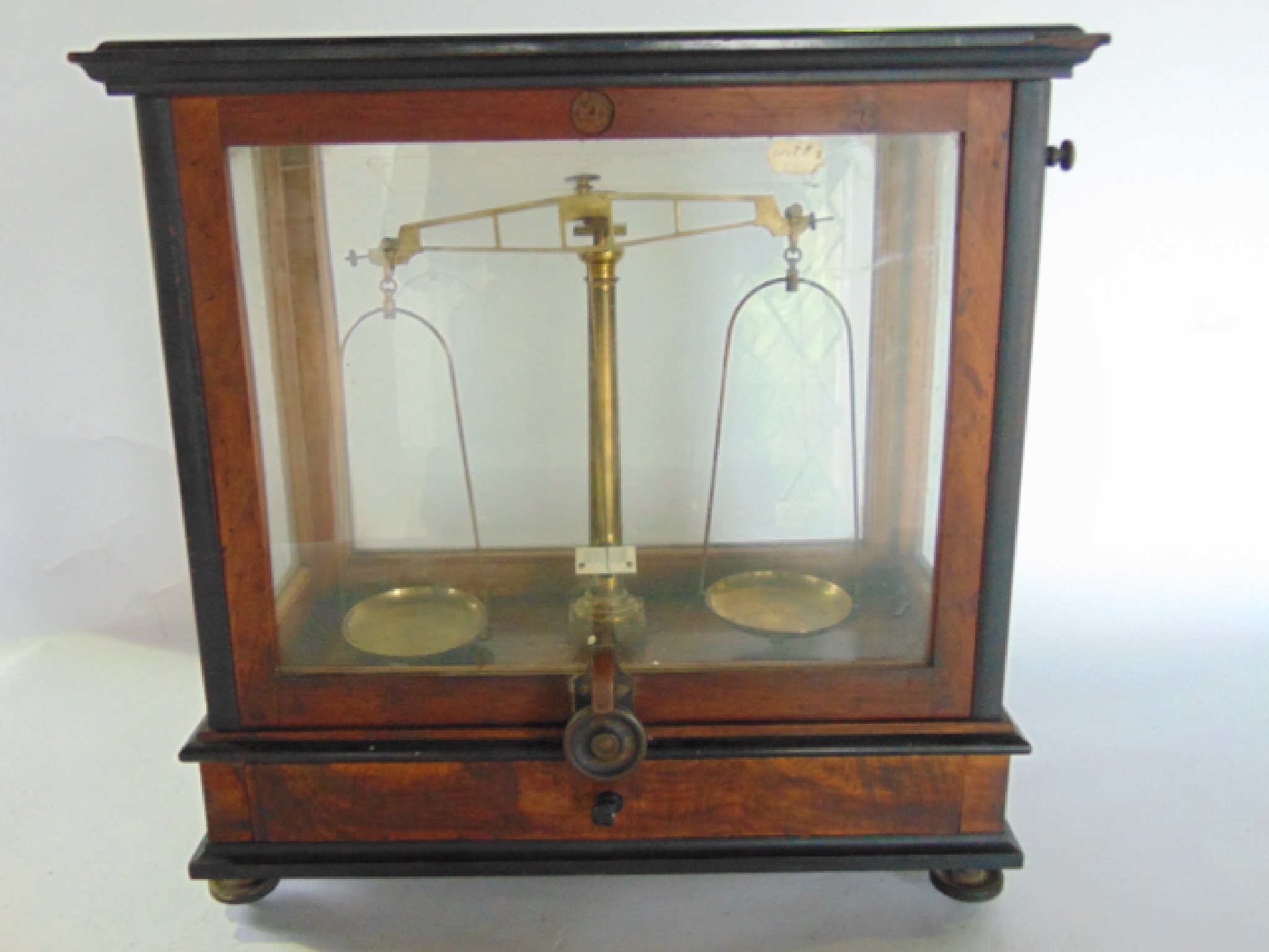 Appraisal: An antique cased set of precision scales set within a