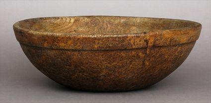 Appraisal: TREENWARE BOWL Of hemispherical form with deep molded border in