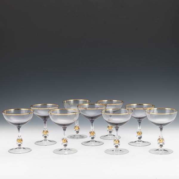 Appraisal: CRYSTAL CHAMPAGNE COUPES SET OF NINE Nine blown champagne coupes