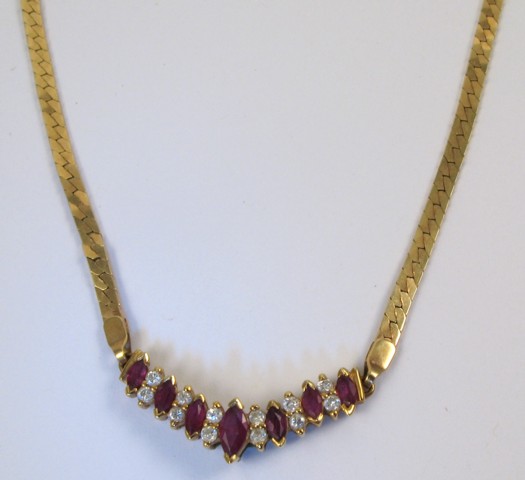 Appraisal: RUBY AND DIAMOND PENDANT NECKLACE k yellow gold The pendant