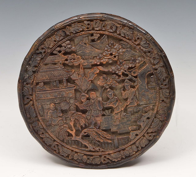 Appraisal: A Chinese Canton tortoiseshell circular box th Centurycarved with figures