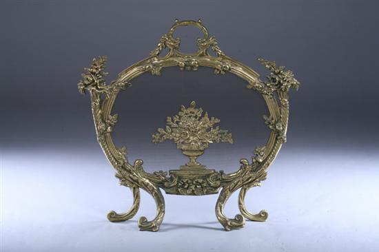 Appraisal: LOUIS XV STYLE BRASS CARTOUCHE-FORM FIRESCREEN late th century Mesh