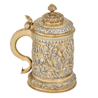 Appraisal: GILT SILVER REPOUSSE TANKARD Decorated in a floral repousse design