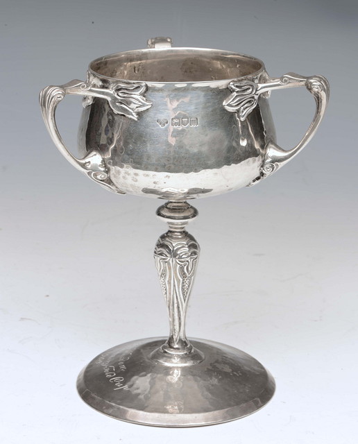 Appraisal: A THREE HANDLED SILVER TROPHY with planished bowl and foot