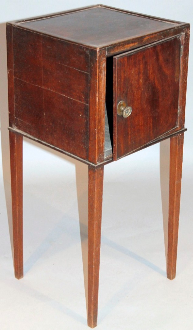 Appraisal: An early thC mahogany bedside cabinet of square outline with