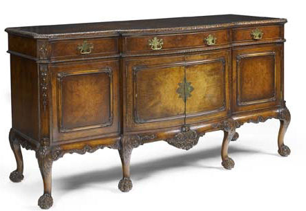 Appraisal: An early th century walnut serpentine sideboard By Waring Gillow