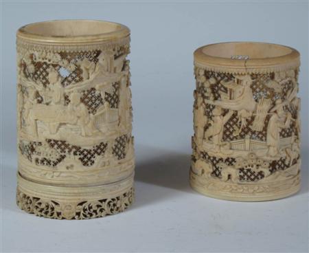 Appraisal: Two similar carved and pierced ivory tusk vases Meiji period