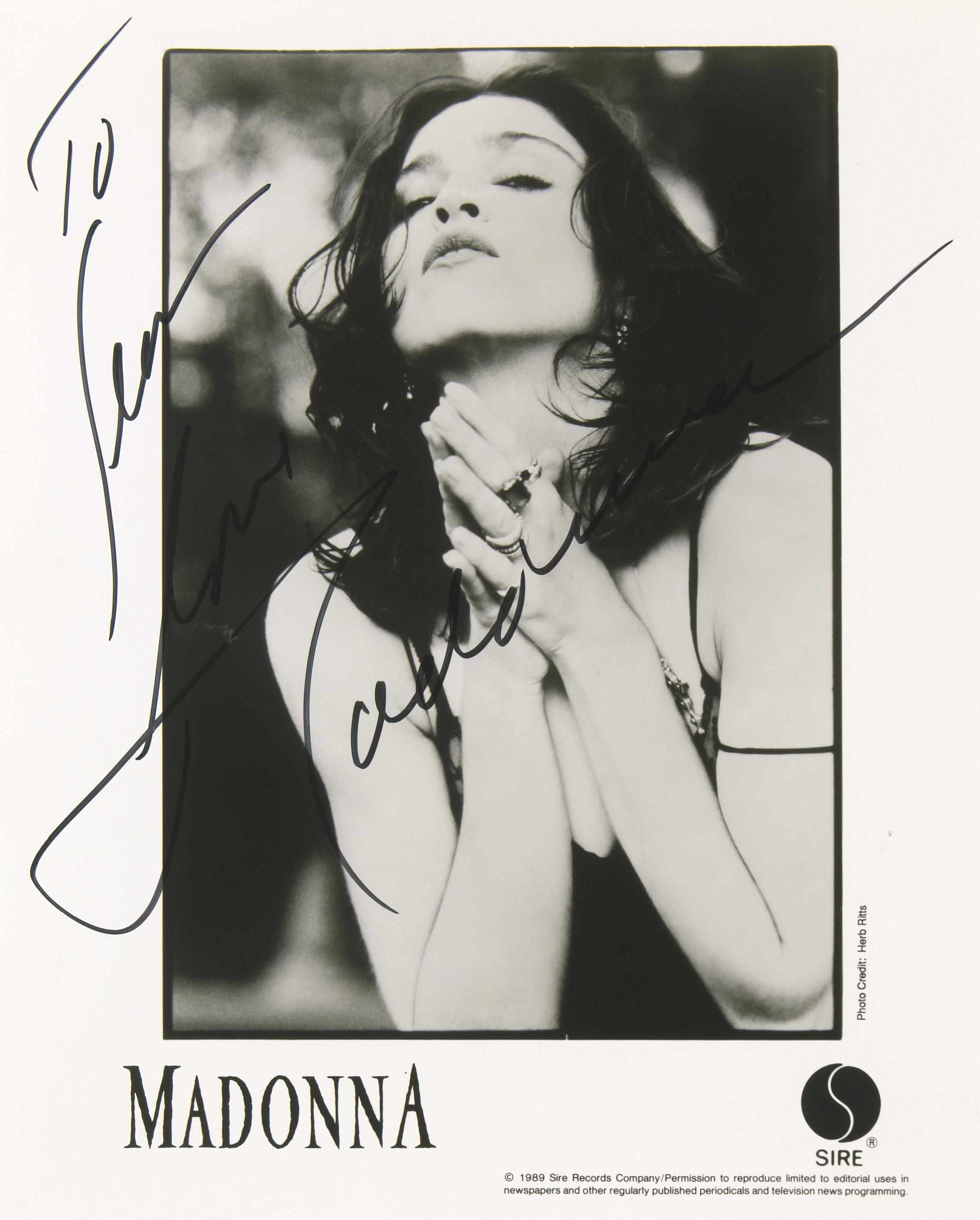 Appraisal: Two Madonna photographs inscribed and signed Silver gelatin prints promotional